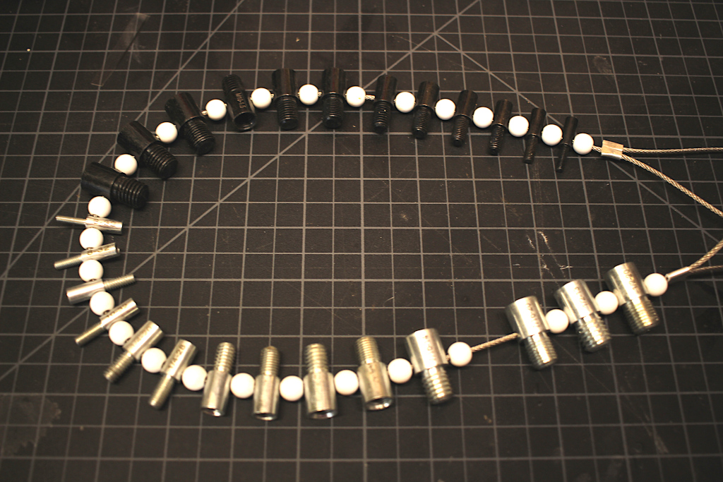 Both male and female sizers strung on a steel cable