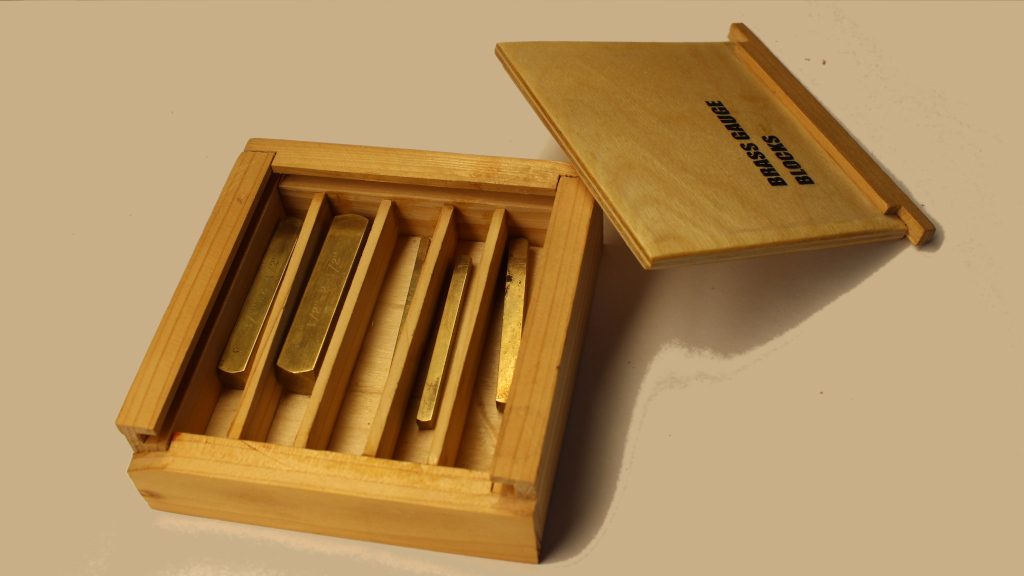 Five brass setup blocks inside